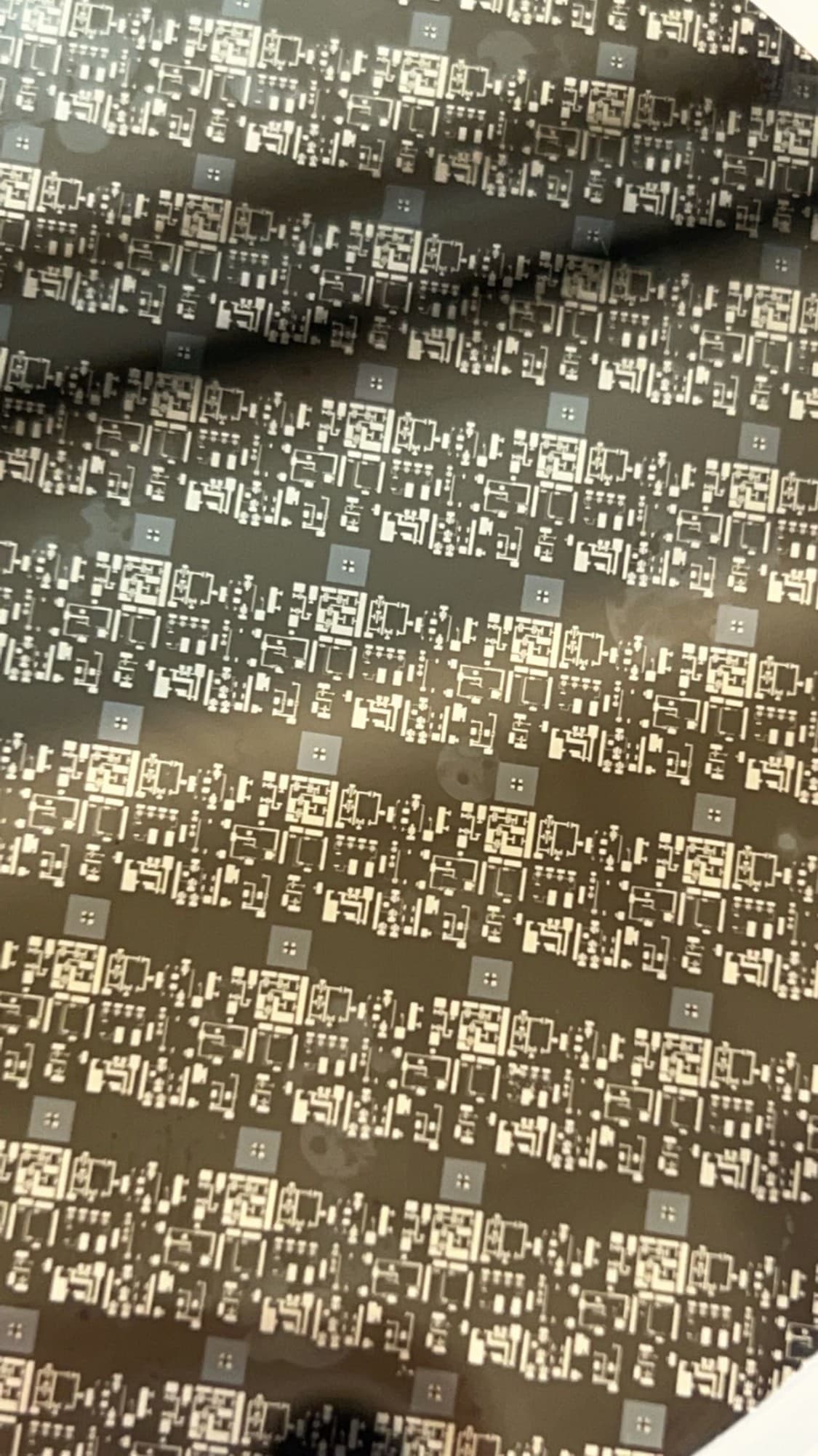 Macro close-up of the patterned die array on the silicon wafer surface